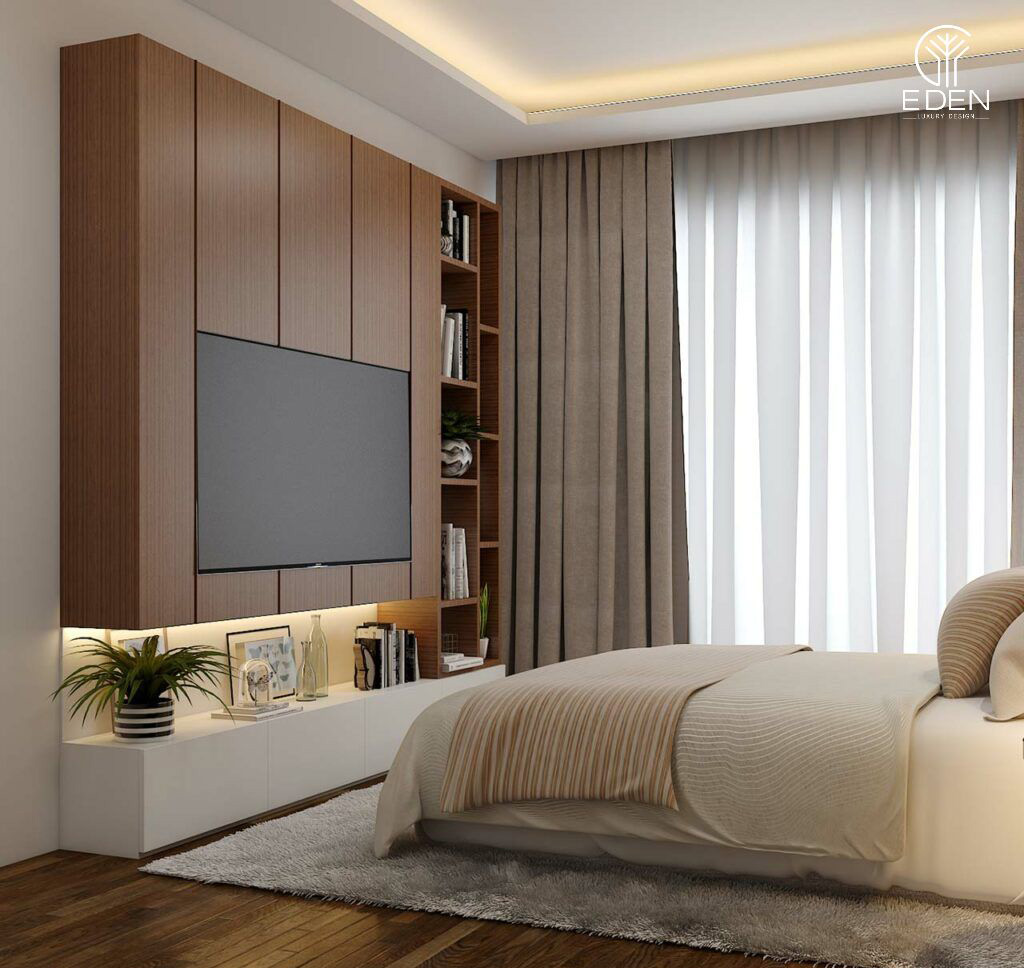 Kệ tivi được thiết kế âm tường kết hợp với tủ đựng đồ tạo nên không gian thoải mái và sang trọng cho căn phòng
