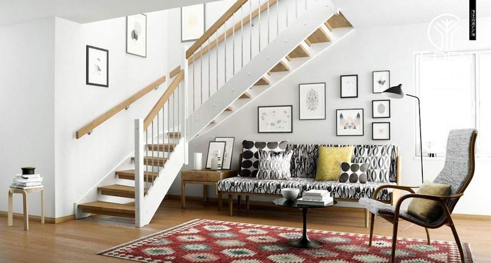 Tranh treo tường là thứ không thể thiếu khi trang trí phòng khách có cầu thang
