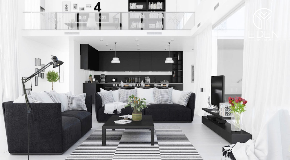 Một bộ sofa đen sẽ làm điểm nhấn cho tổng thể không gian phòng khách màu trắng