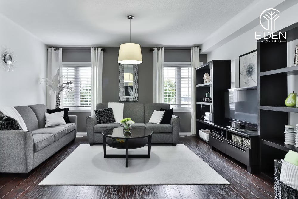 Sofa, đèn, đồ vật decor được sắp xếp hợp lý và thông minh tạo nên một phòng khách màu xám trắng tuyệt vời
