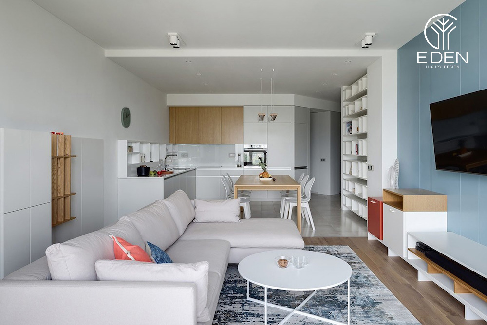 Phòng khách hiện đại với gam màu trắng sáng thiết kế liền bếp cho nhà chung cư